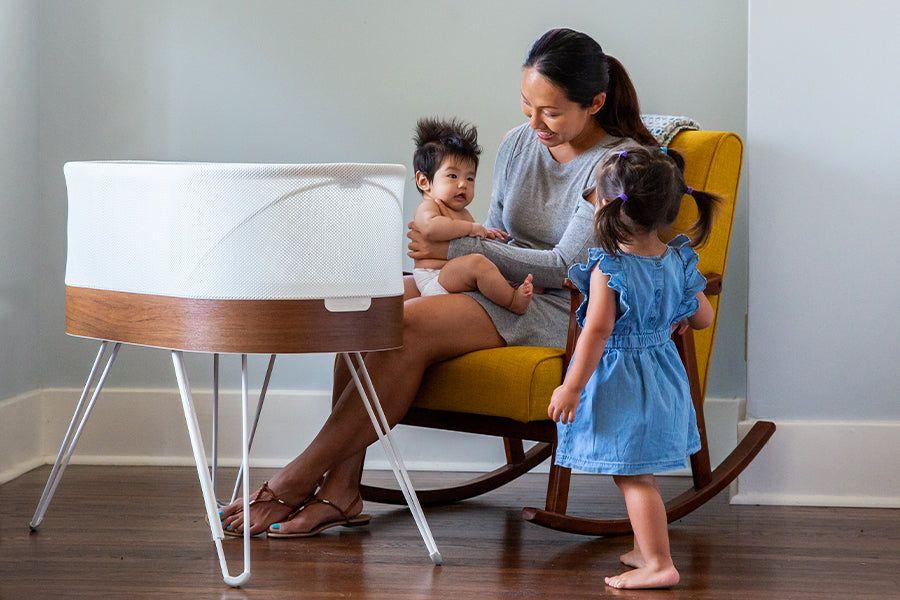 Mom, baby, toddler and SNOO