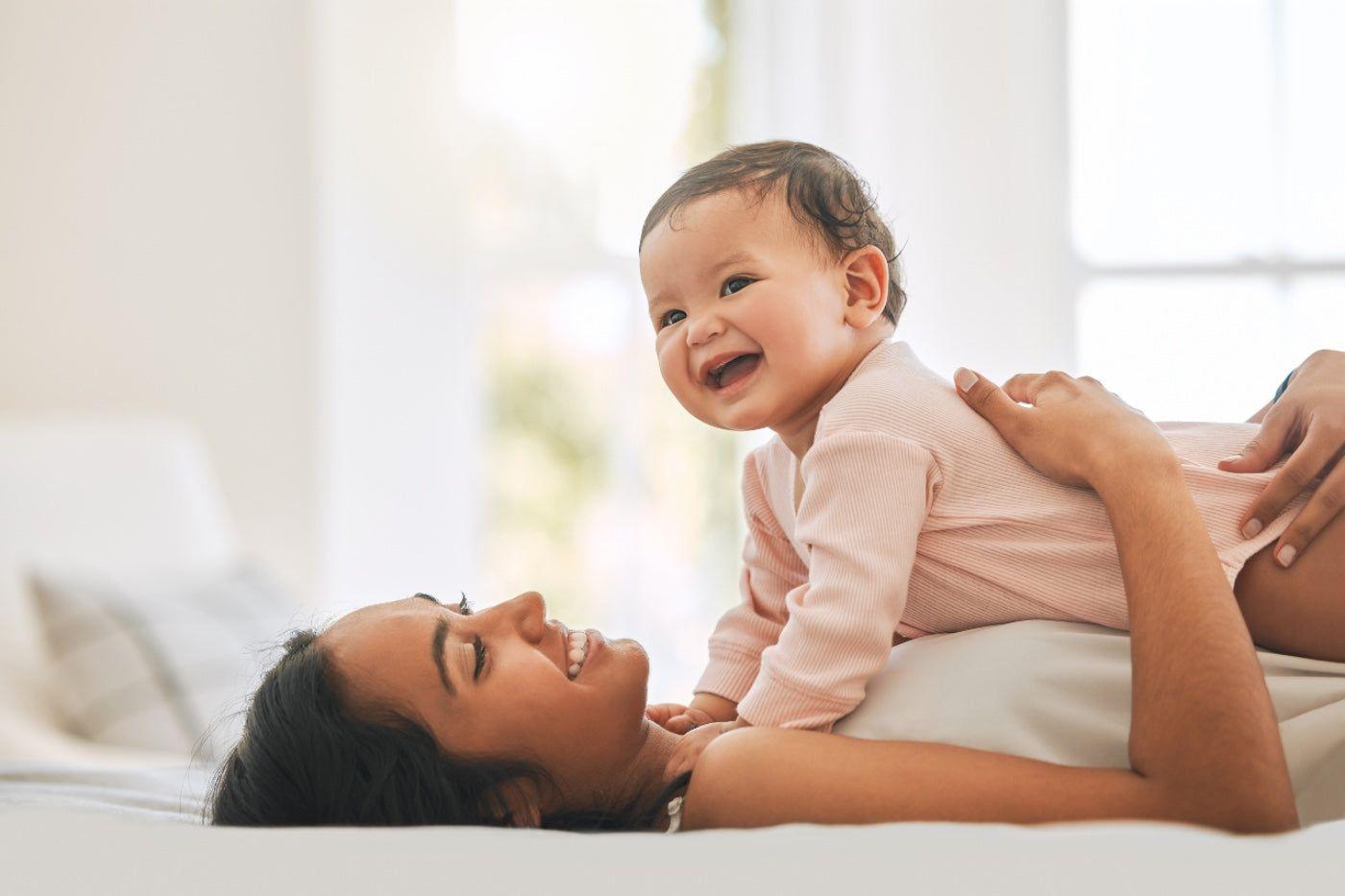 A baby does tummy time with her mum