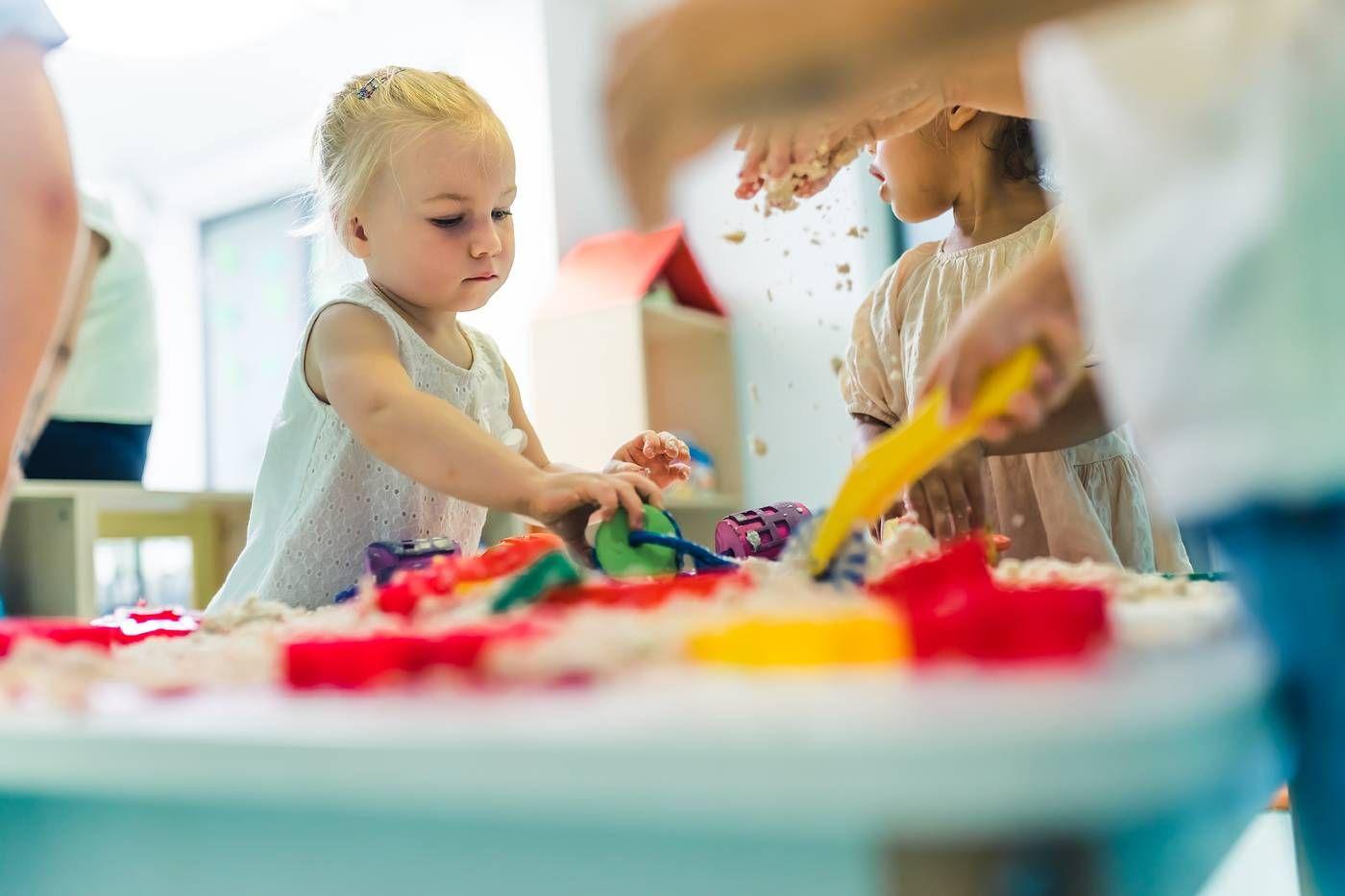 Toddlers playing on their first day of daycare