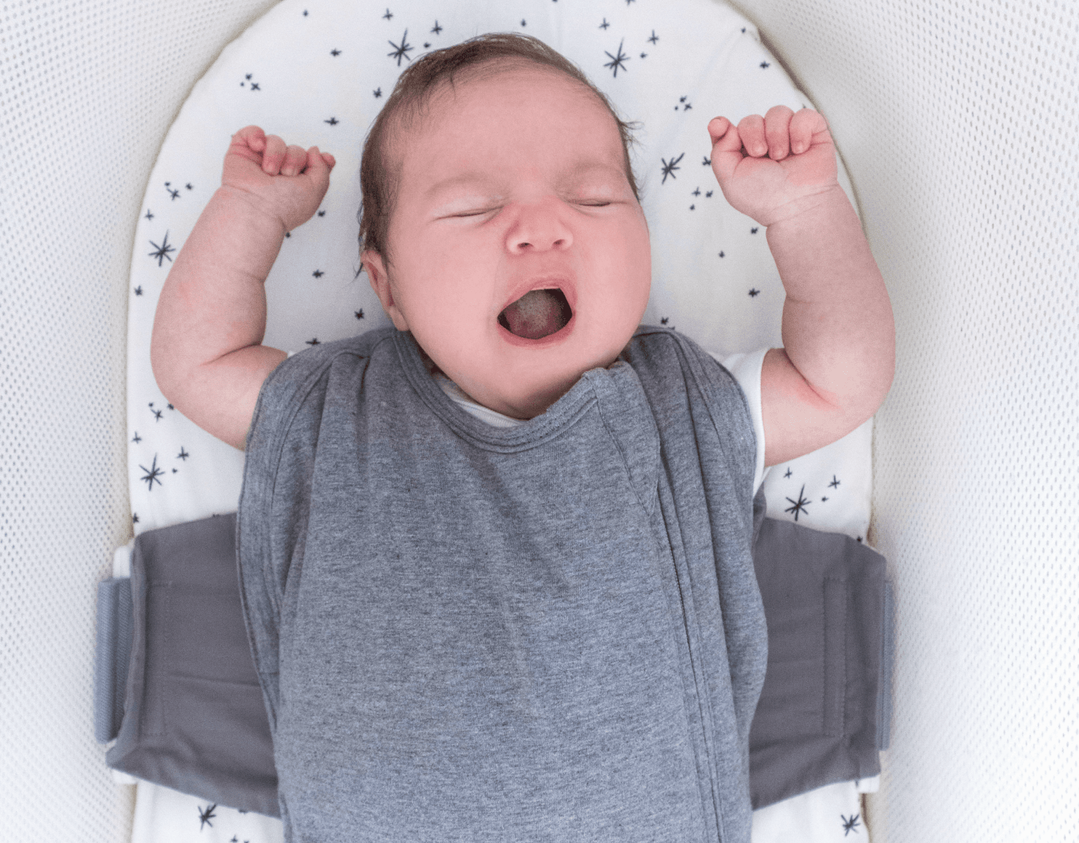 Picture if Baby in SNOO comforter sack with arms out