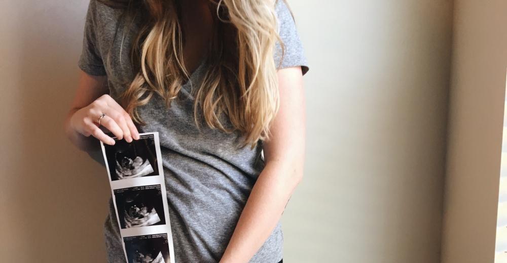 Mom with ultrasound pictures