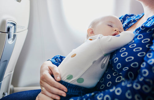 9 Tips That’ll Take the Stress Out of Flying With a Baby